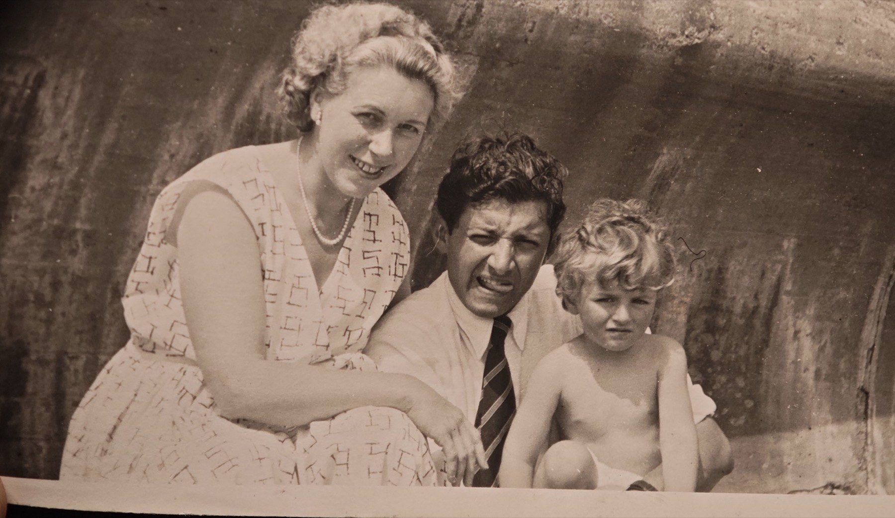 Jean and Sam on Goodrington beach with my dad as a small child.